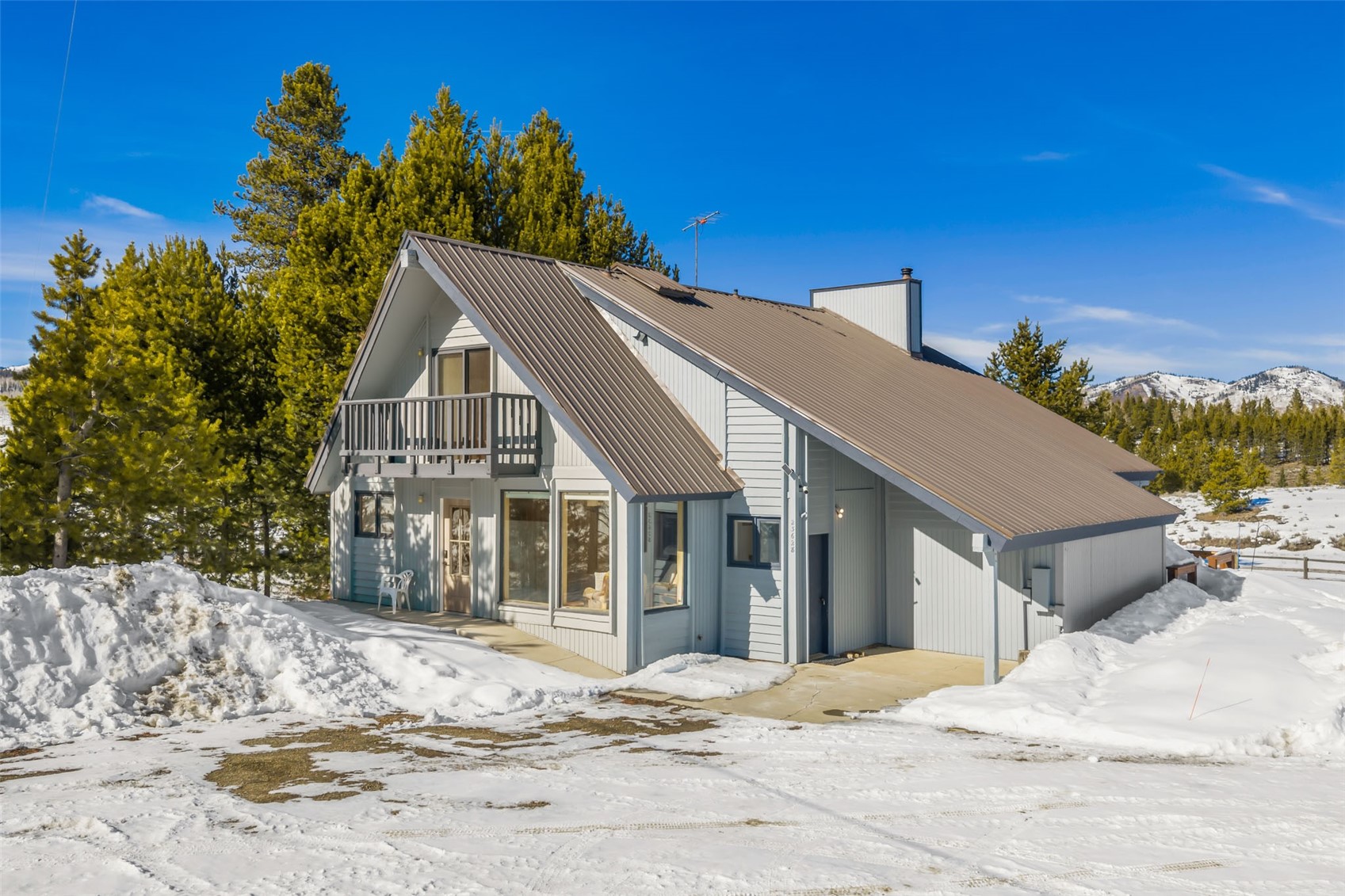 23628 County Road 62 Clark, CO 80428 - Photo 37 of 50 a view of a house with a snow in the background