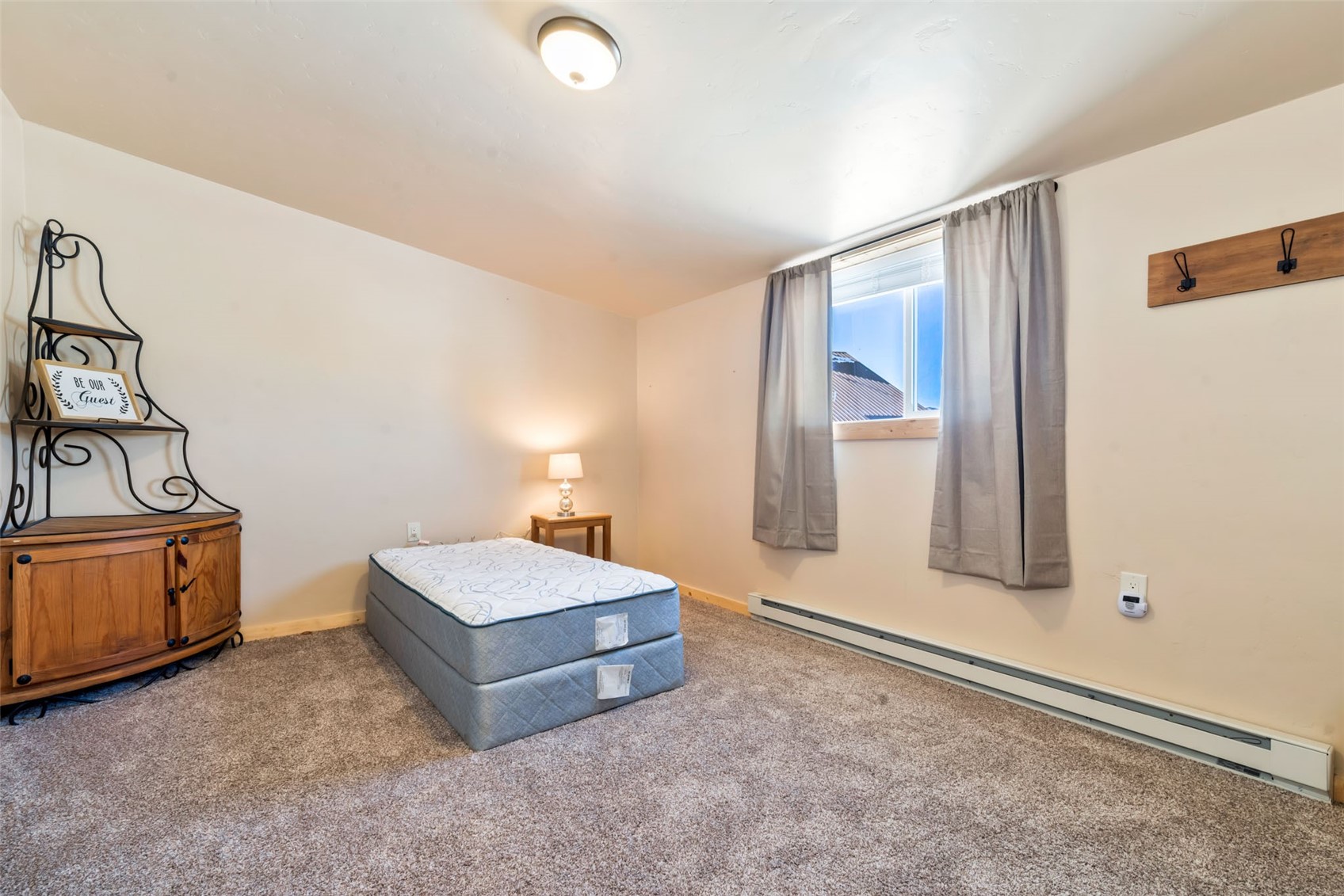 23628 County Road 62 Clark, CO 80428 - Photo 44 of 50 a spacious bedroom with a bed and dresser