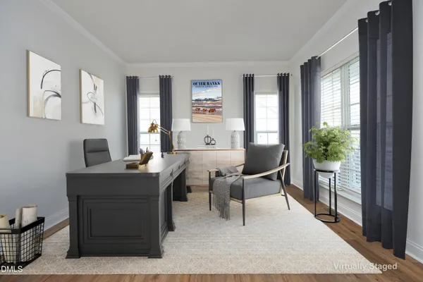 a work room with furniture and a window