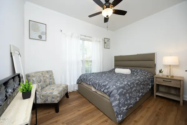 a bedroom with a bed and a couch