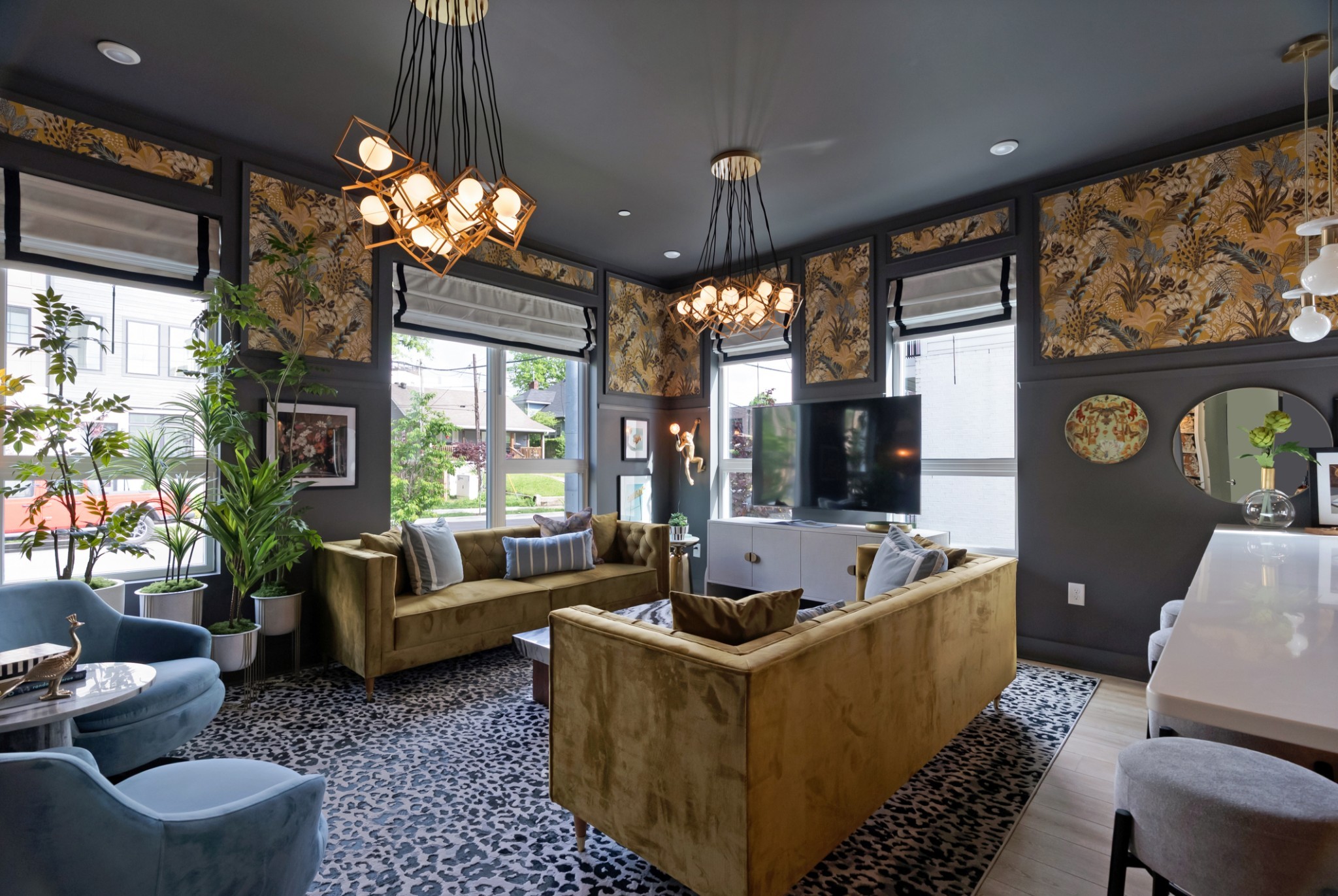 a living room with furniture flat screen tv and a large window