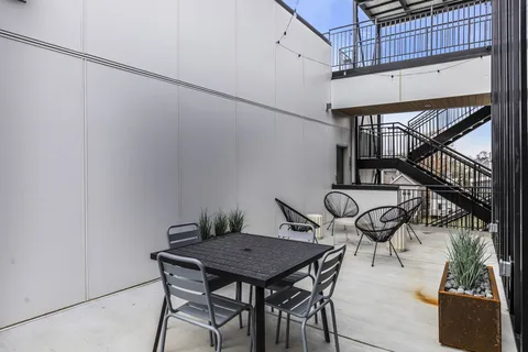 an aerial view of a house with yard swimming pool and outdoor seating