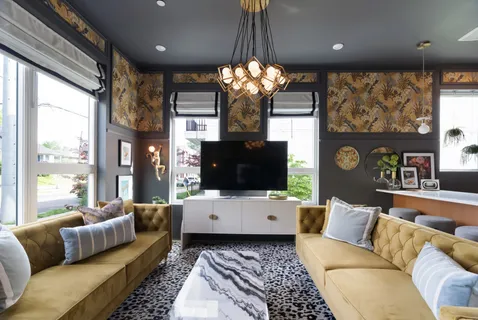 a living room with furniture a flat screen tv and a large window