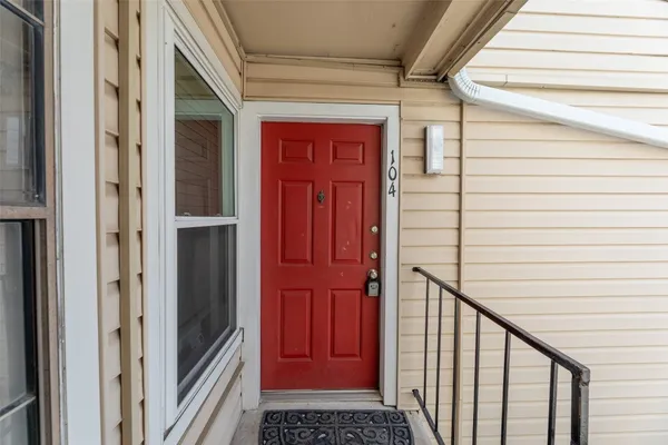 a view of a hallway with wooden walls and stairs