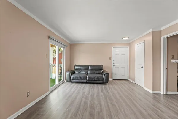 a living room with furniture and a window