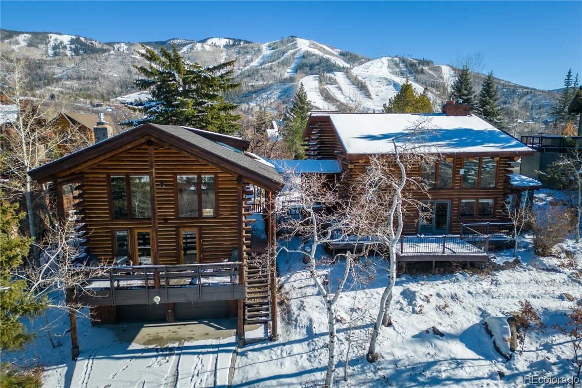 1527 Natches Road Steamboat Springs, CO 80487 - Photo 1 of 50 a front view of a house with a yard