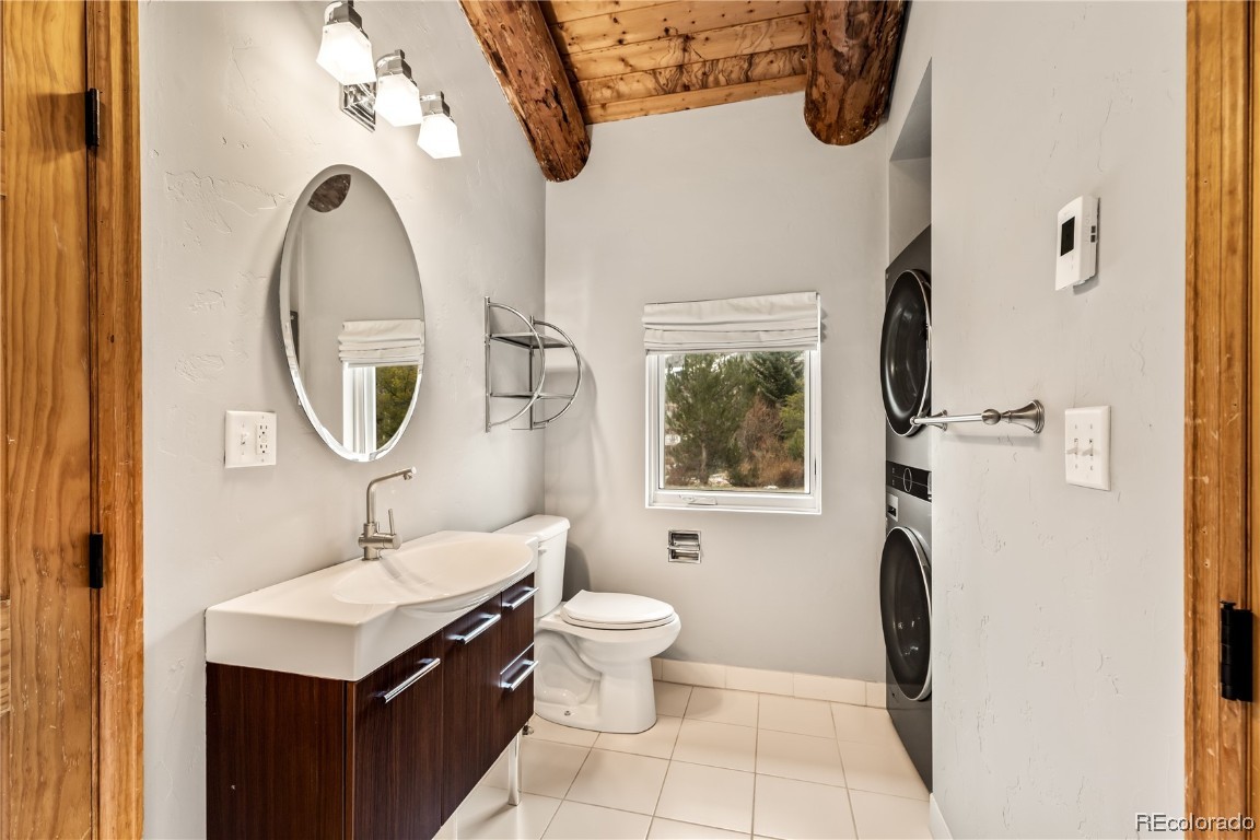 1527 Natches Road Steamboat Springs, CO 80487 - Photo 20 of 50 a bathroom with a sink a toilet and a mirror