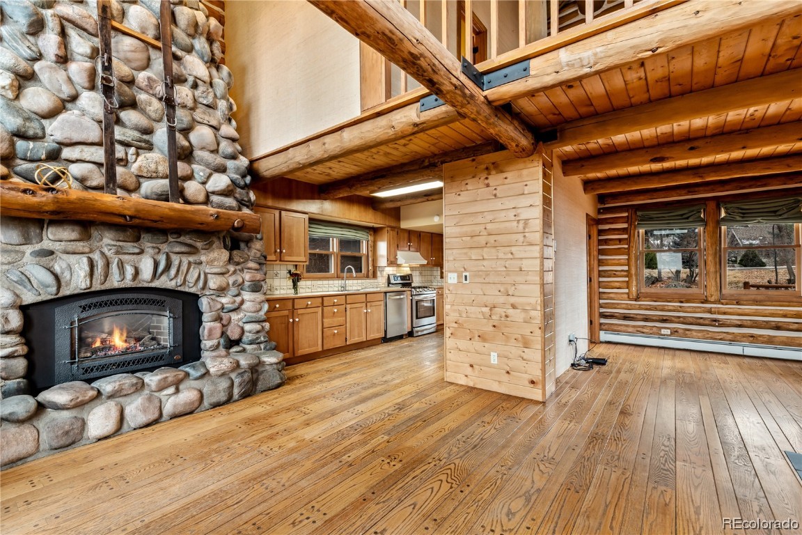 1527 Natches Road Steamboat Springs, CO 80487 - Photo 30 of 50 a view of a livingroom with wooden floor and a fireplace
