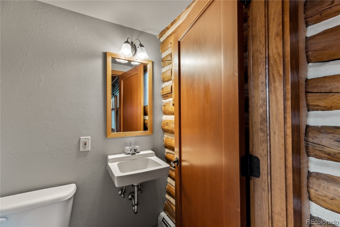 1527 Natches Road Steamboat Springs, CO 80487 - Photo 45 of 50 a bathroom with a sink a toilet and shower