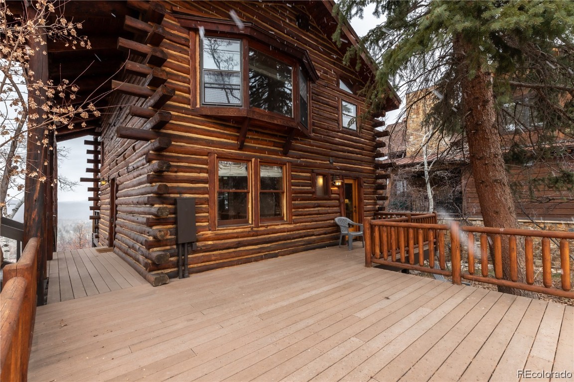 1527 Natches Road Steamboat Springs, CO 80487 - Photo 48 of 50 a view of deck with wooden floor and outdoor seating