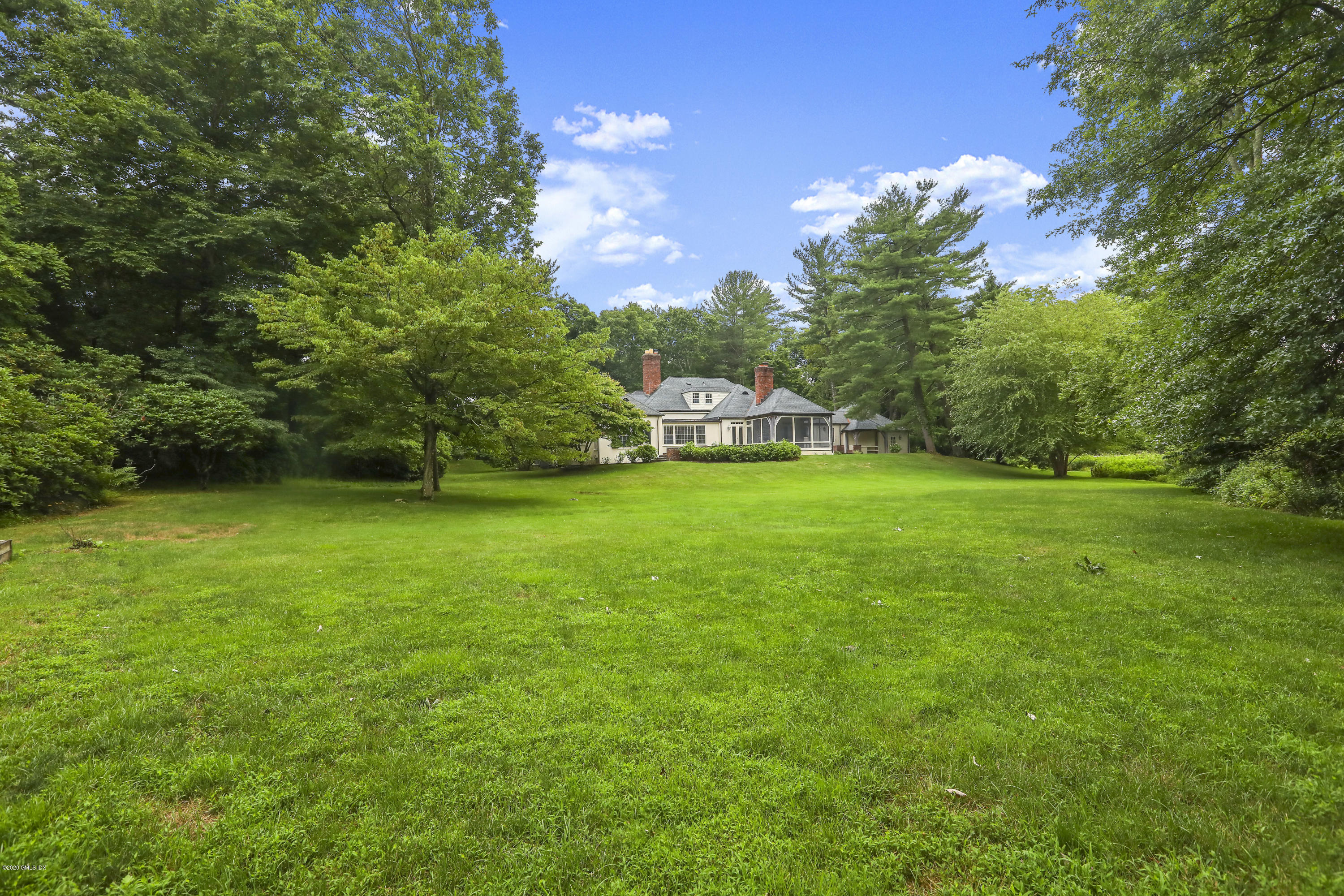 155 Clapboard Ridge Road Greenwich, CT 06831 - Photo 1 of 24 a view of a field of grass and trees