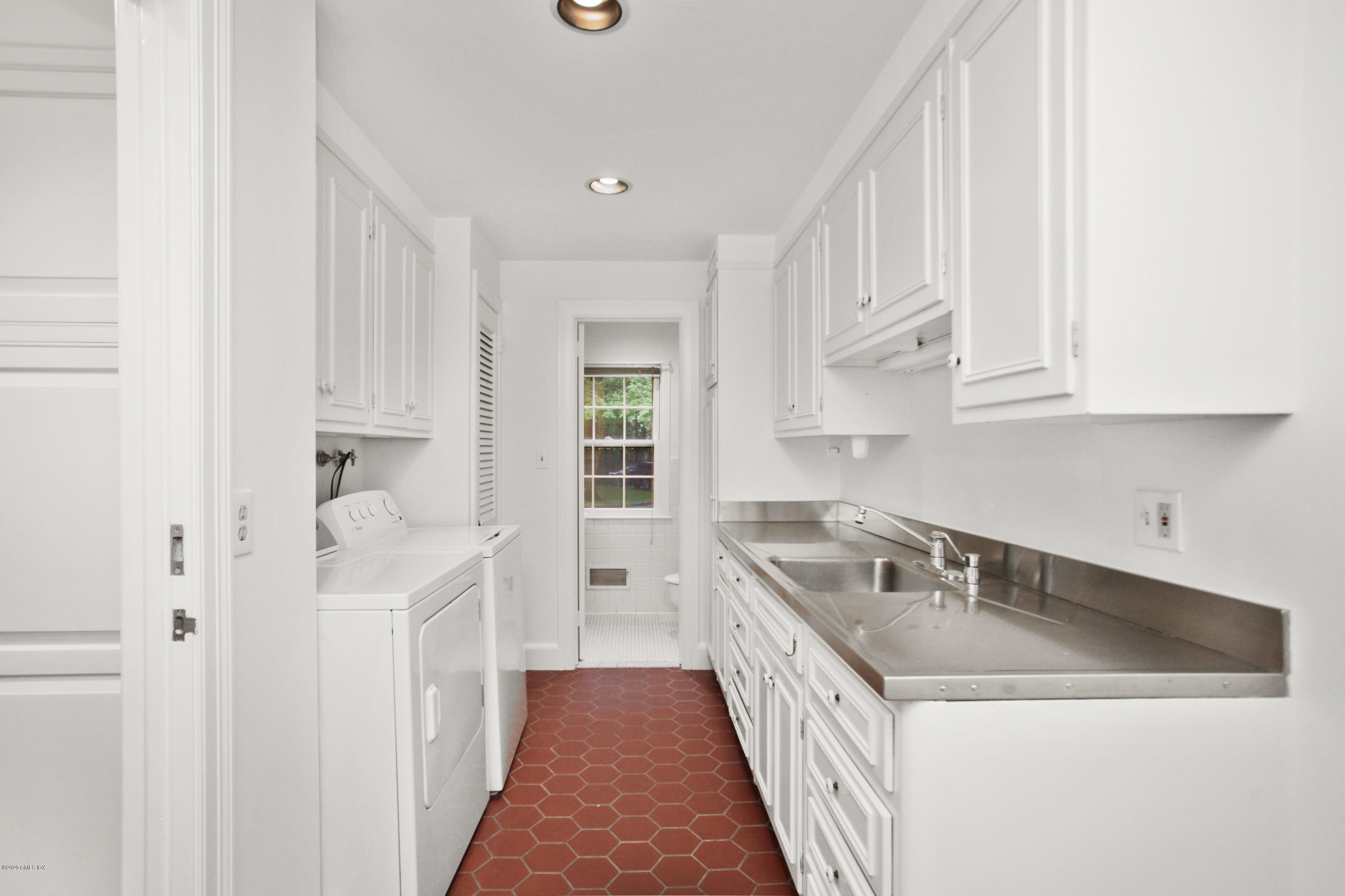 155 Clapboard Ridge Road Greenwich, CT 06831 - Photo 14 of 24 a kitchen that has a sink and a stove