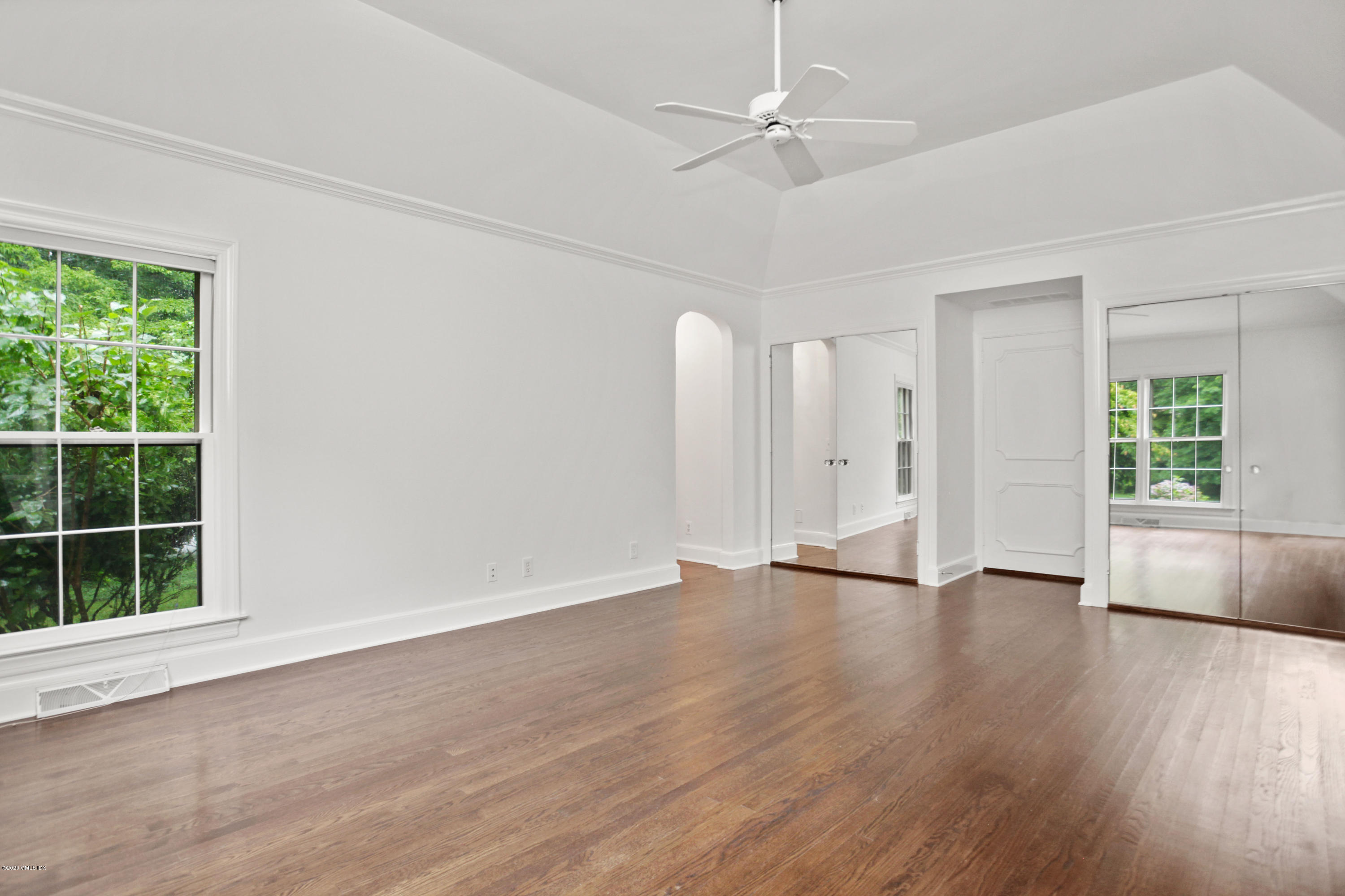 155 Clapboard Ridge Road Greenwich, CT 06831 - Photo 16 of 24 a view of an empty room with wooden floor and a window