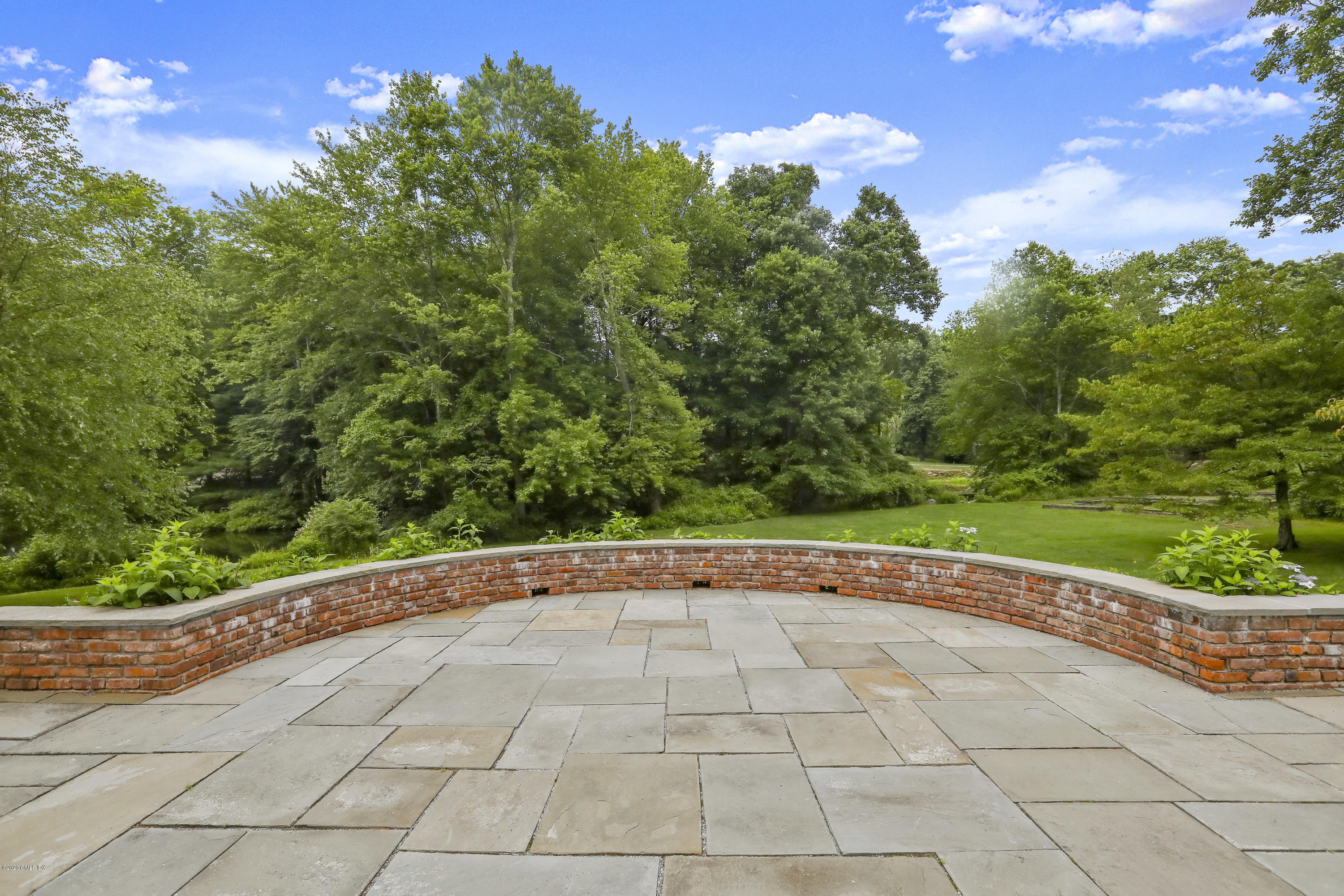 155 Clapboard Ridge Road Greenwich, CT 06831 - Photo 23 of 24 a view of a yard with potted plants