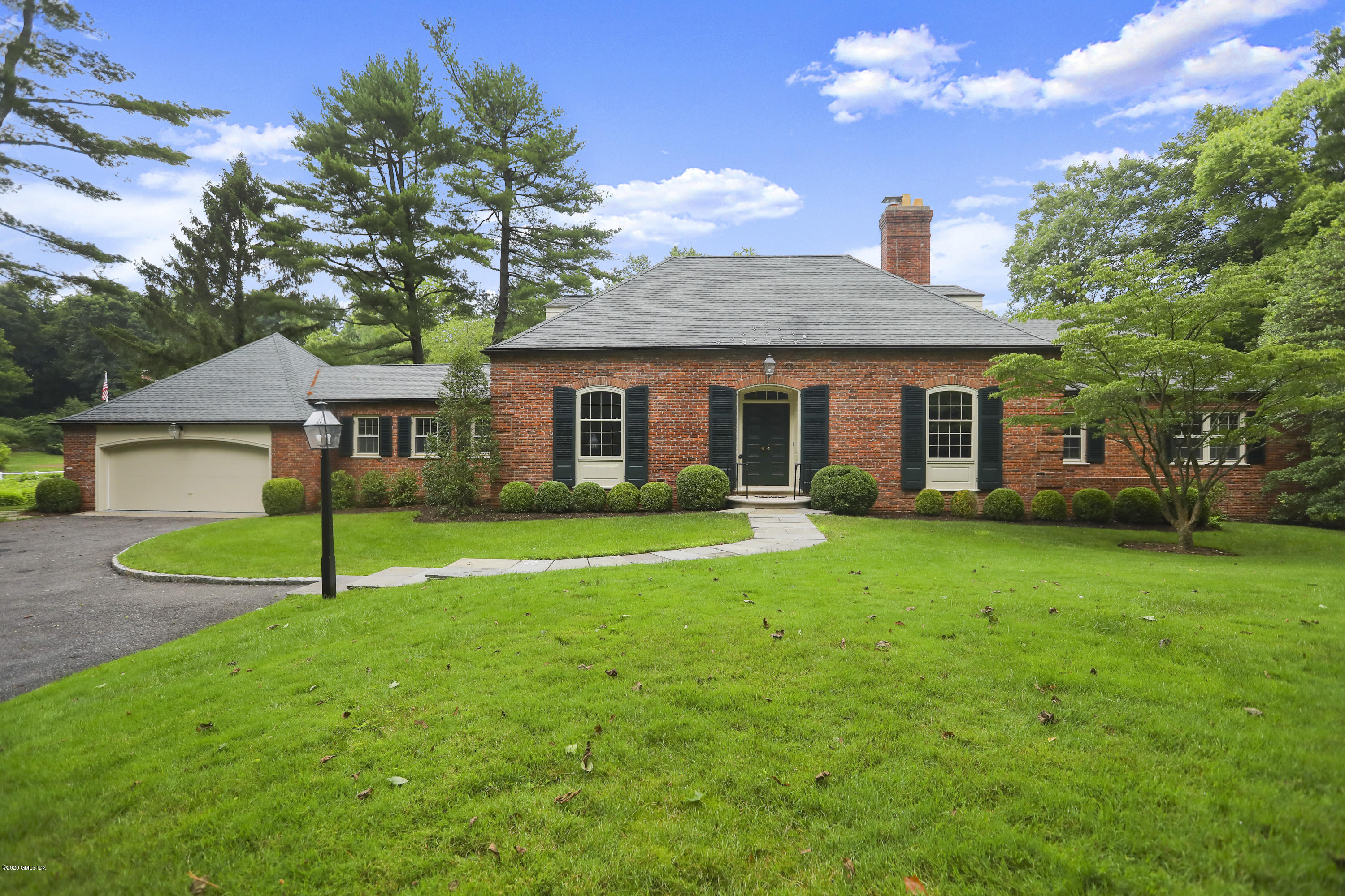 155 Clapboard Ridge Road Greenwich, CT 06831 - Photo 4 of 24 a house that has a big yard