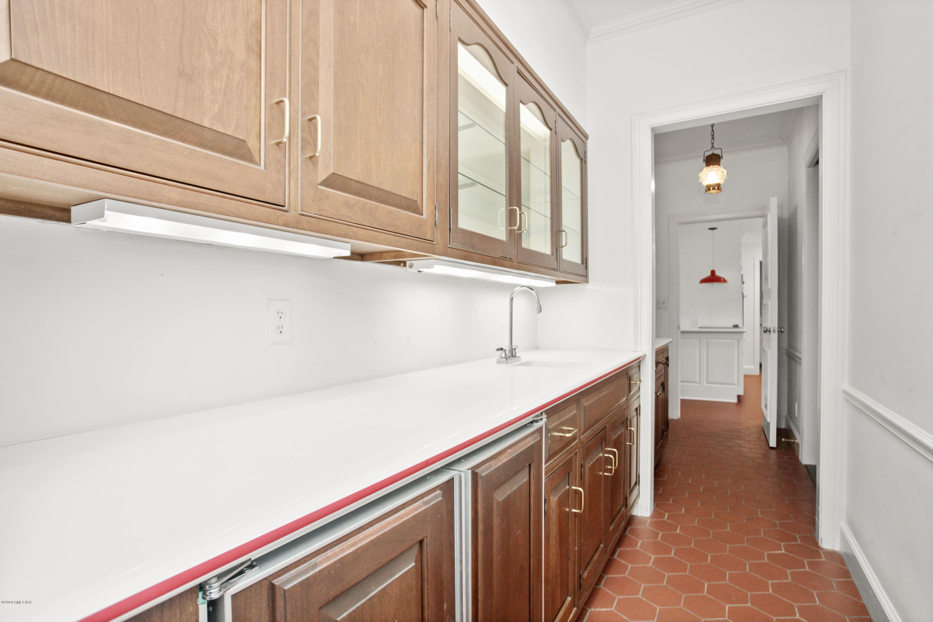 155 Clapboard Ridge Road Greenwich, CT 06831 - Photo 10 of 24 a kitchen with a sink and cabinets