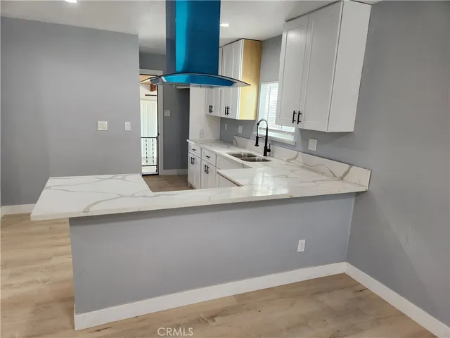 a kitchen with a sink and cabinets