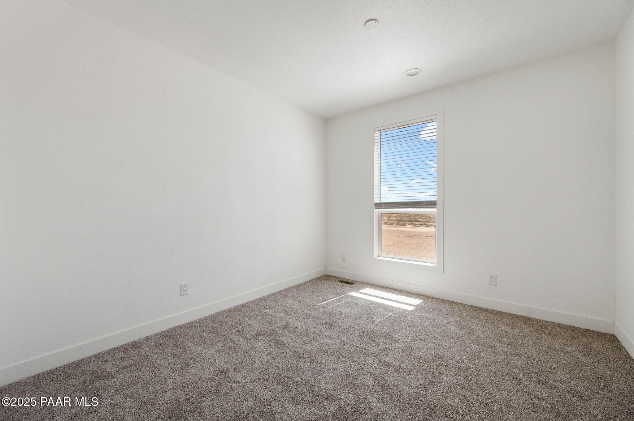 2758 West Altimeter Way Paulden, AZ 86334 - Photo 20 of 24 a view of an empty room with a window