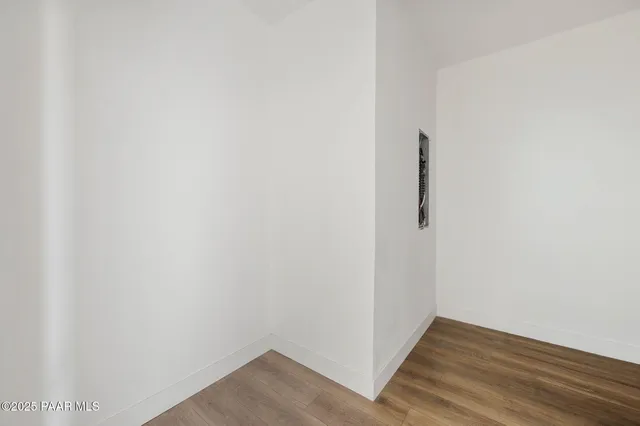 a view of a small space with wooden floor