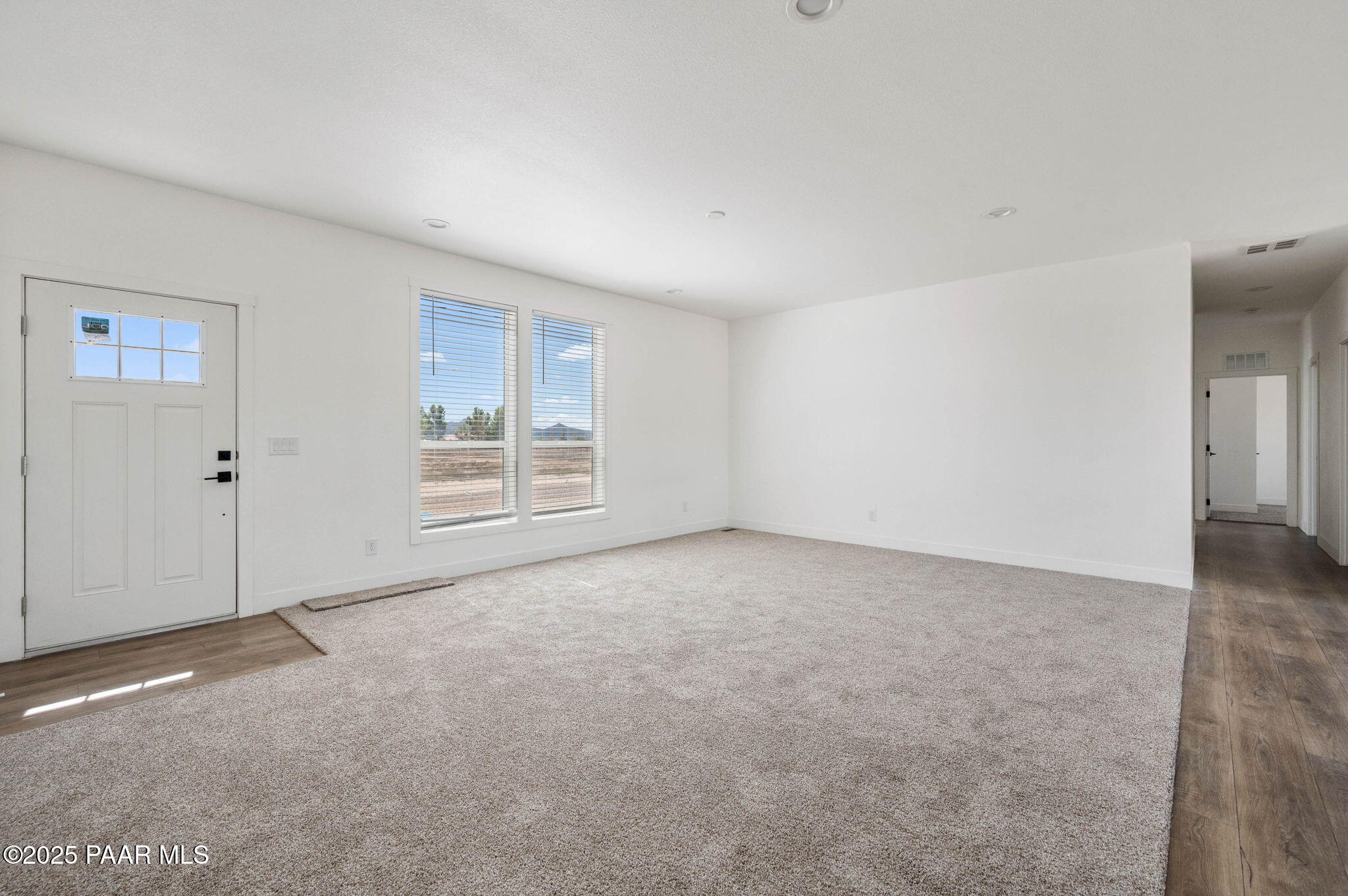 2758 West Altimeter Way Paulden, AZ 86334 - Photo 4 of 24 a view of an empty room with a window