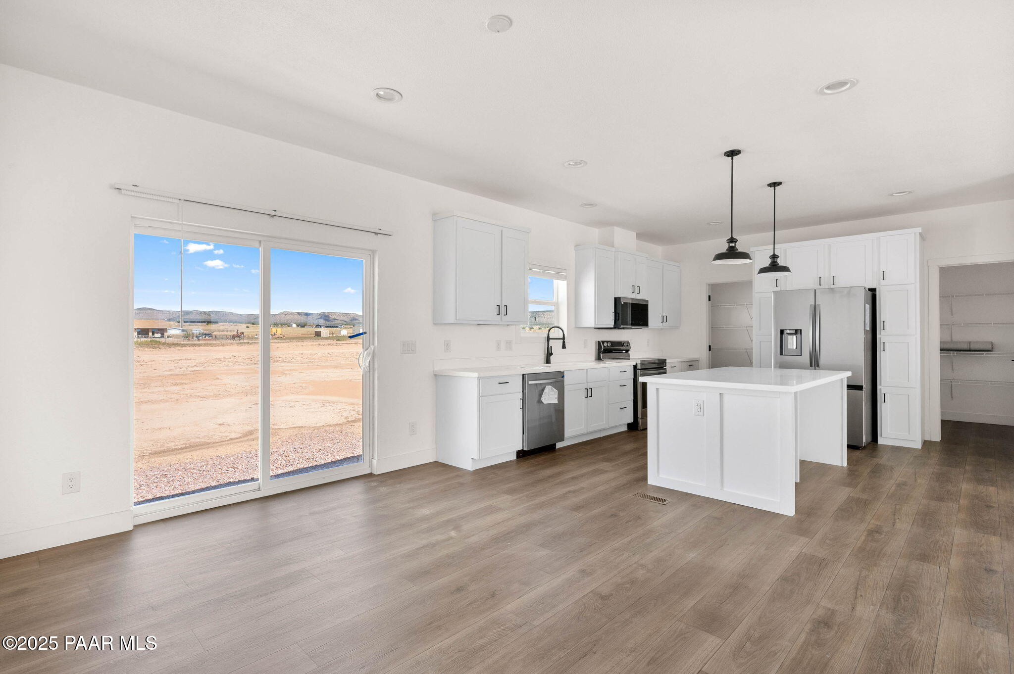 2758 West Altimeter Way Paulden, AZ 86334 - Photo 6 of 24 a view of a kitchen with wooden floor