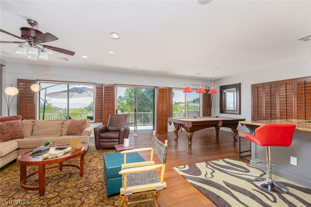 22 Douglas Grove Road Henderson, NV 89052 - Photo 46 of 72 Sliding glass doors open to expansive outdoor views from this entertainment-ready living space.
