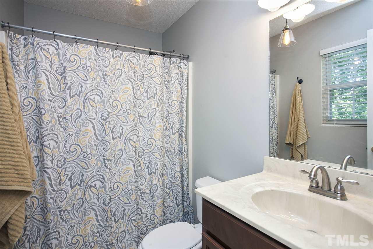 1145 Marlborough Road Raleigh, NC 27610 - Photo 11 of 17 a bathroom with a sink and a mirror