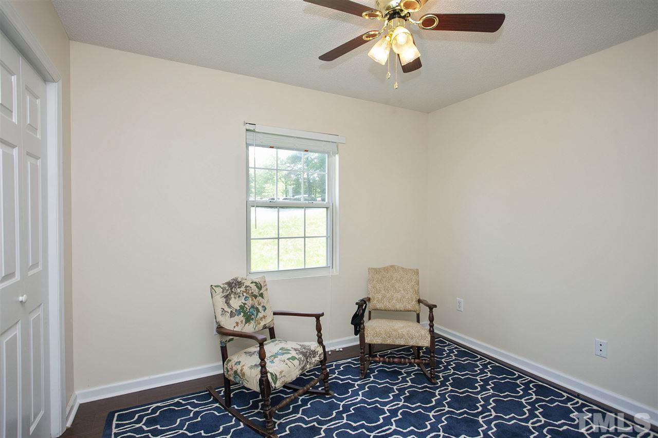 1145 Marlborough Road Raleigh, NC 27610 - Photo 12 of 17 a dining room with furniture and chandelier
