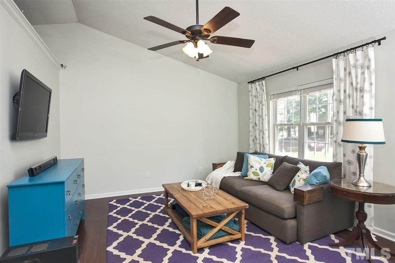 1145 Marlborough Road Raleigh, NC 27610 - Photo 3 of 17 a living room with furniture and a flat screen tv