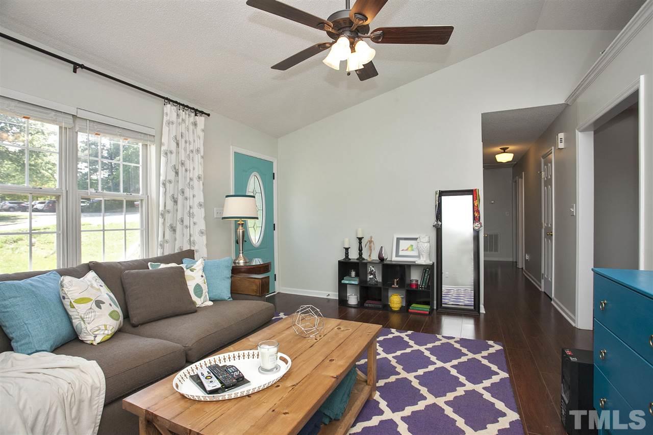 1145 Marlborough Road Raleigh, NC 27610 - Photo 4 of 17 a living room with furniture and a large window