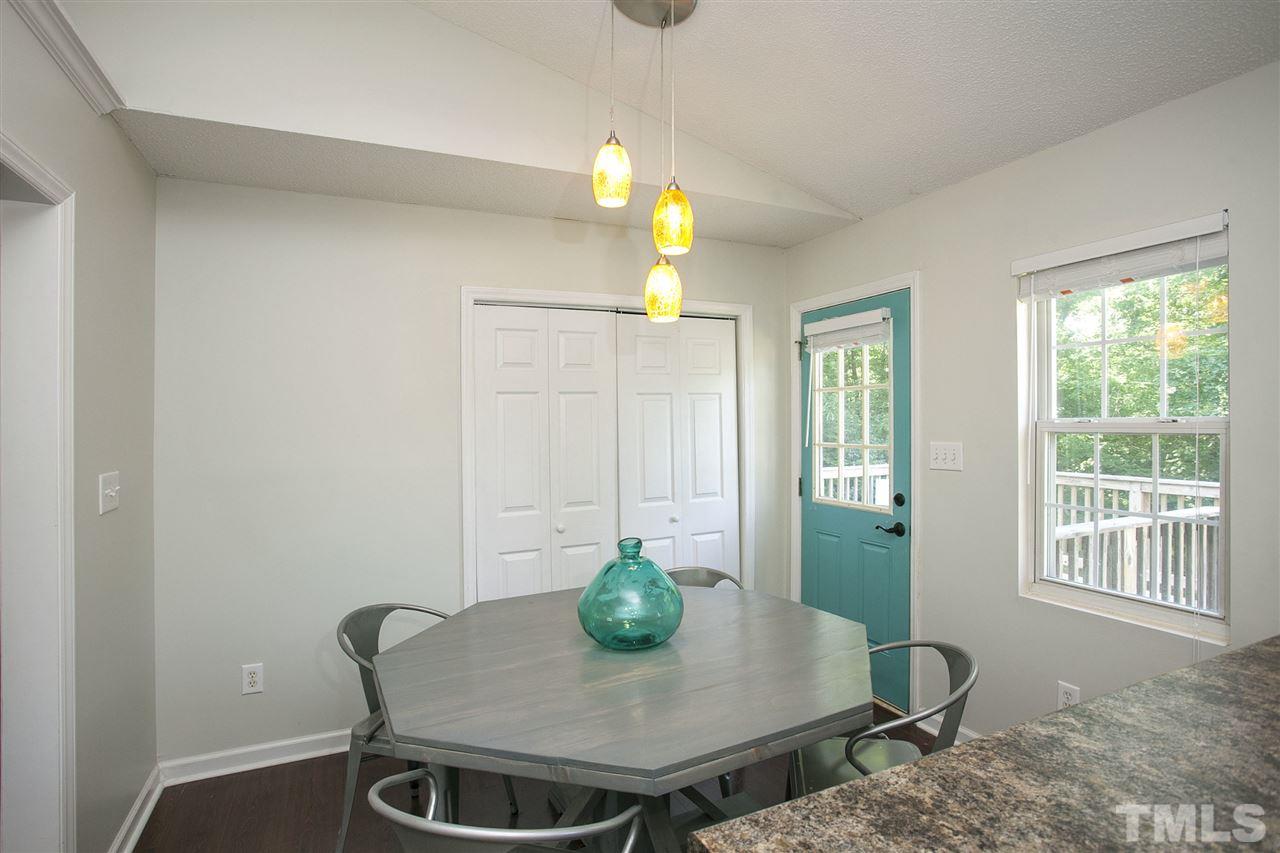 1145 Marlborough Road Raleigh, NC 27610 - Photo 7 of 17 a view of a dining room with furniture window and wooden floor