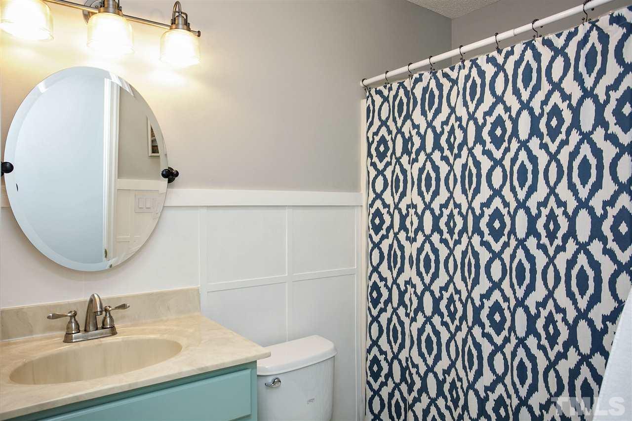 1145 Marlborough Road Raleigh, NC 27610 - Photo 8 of 17 a bathroom with a sink and a mirror