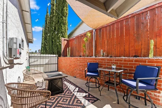 a view of a chairs and table in the patio