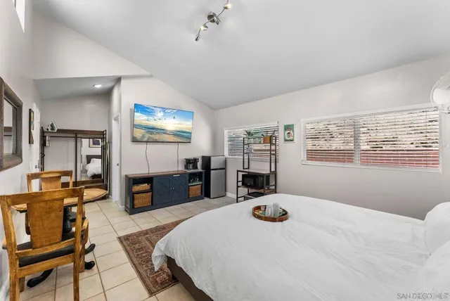 a bed room with a bed and furniture