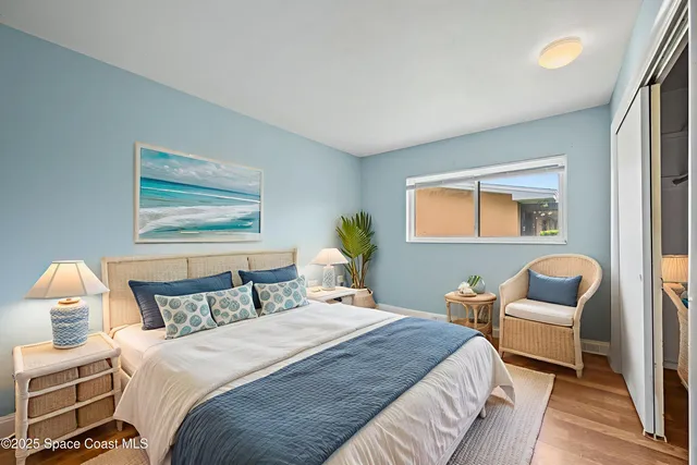 a bedroom with a bed and chair