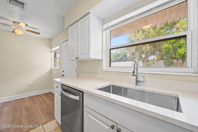 a kitchen with a sink and a window