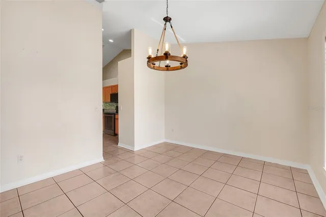 a view of an empty room and wooden floor