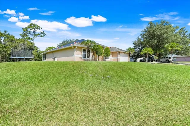 a view of a house with a big yard
