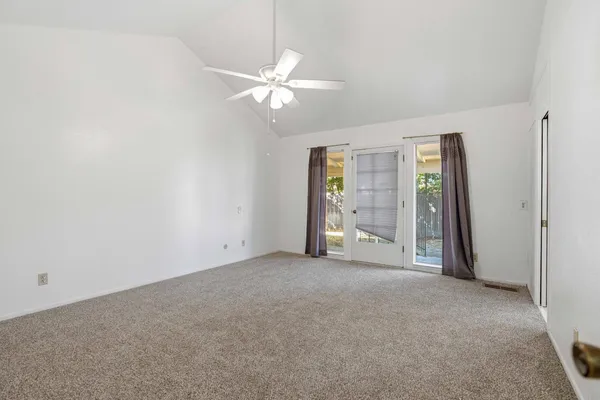 a view of an empty room with a window