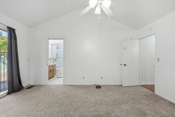 a view of an empty room with a window