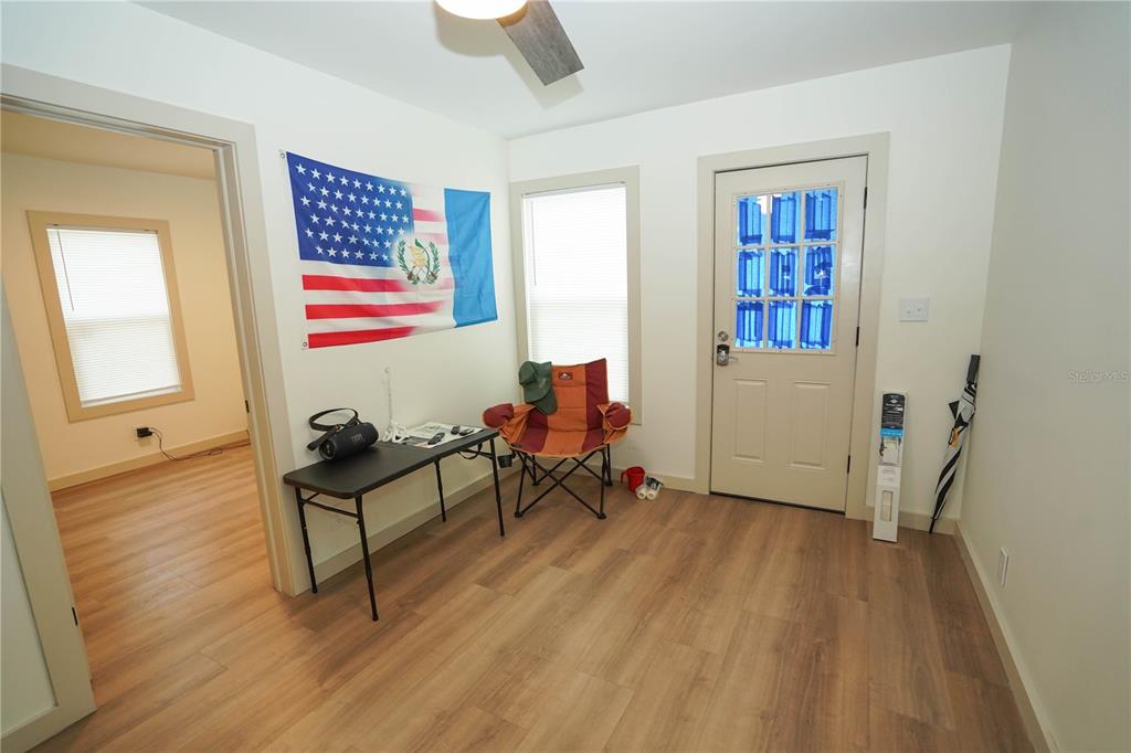 535 14th Avenue South, Unit W St. Petersburg, FL 33701 - Photo 2 of 15 a living room with furniture and a window