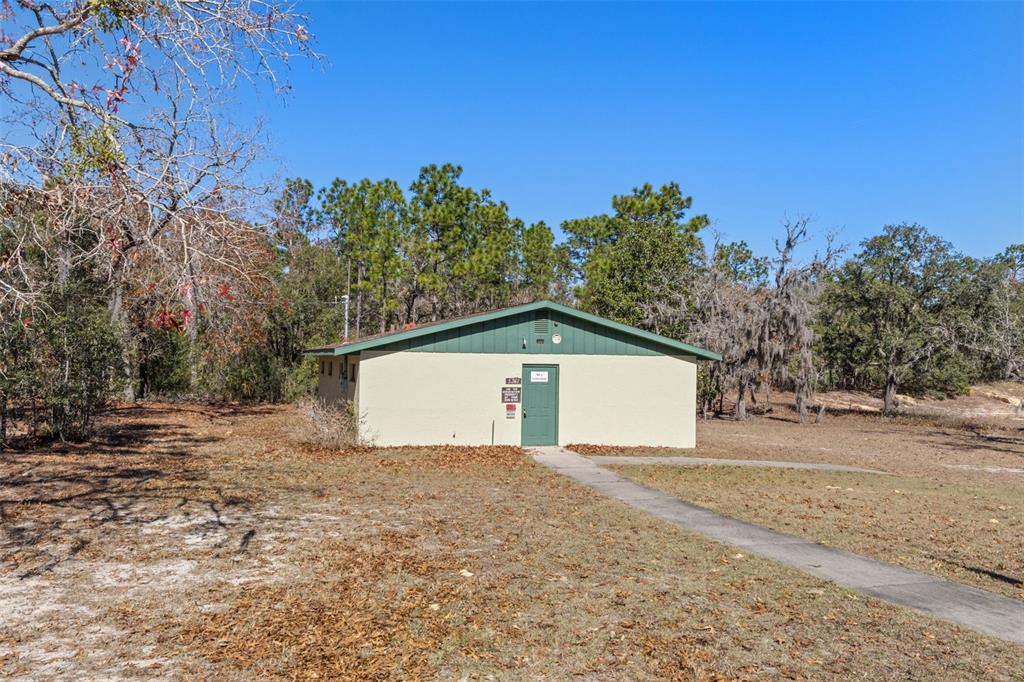 5361 West Cardamon Place Lecanto, FL 34461 - Photo 1 of 1 a front view of a house with a yard and garage