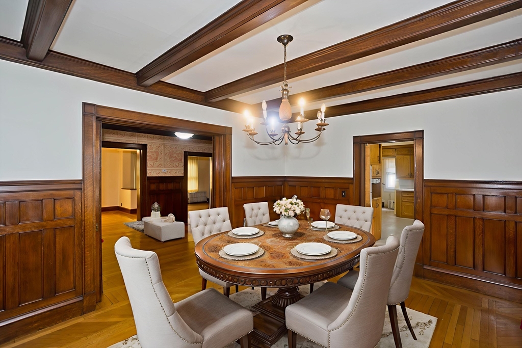 128 Maplewood Terrace Springfield, MA 01108 - Photo 12 of 40 a view of a dining room with furniture and chandelier