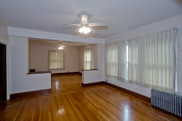 a view of livingroom with hardwood floor and ceiling fan