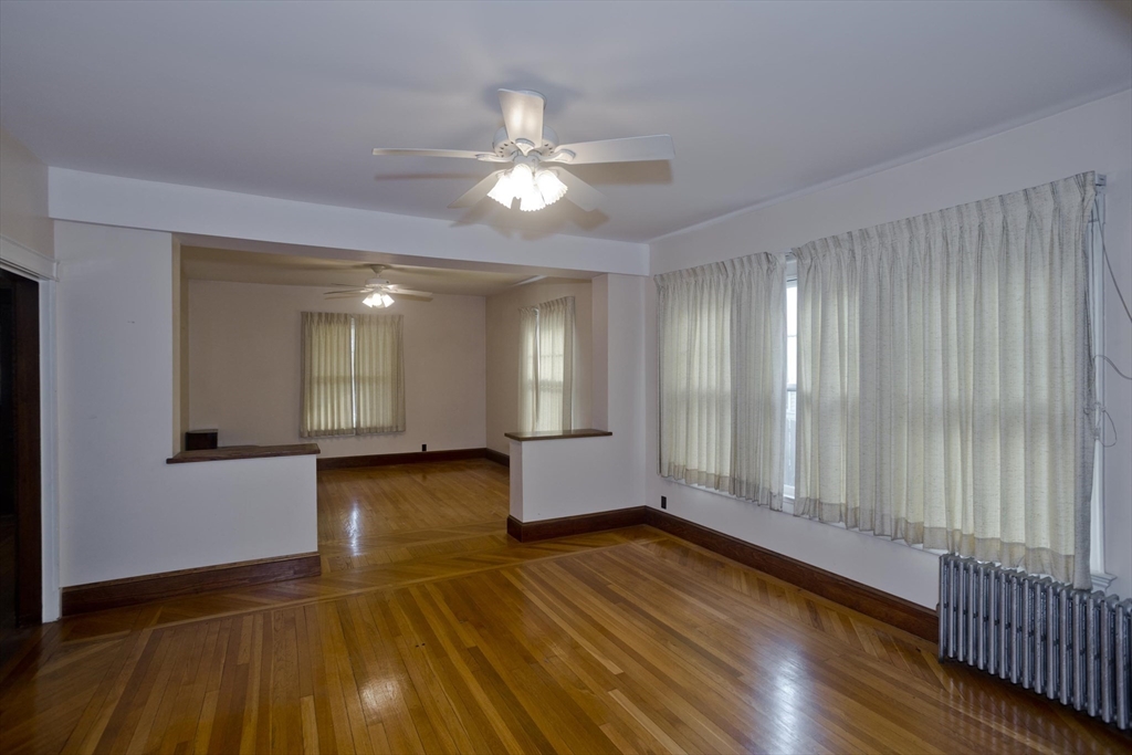 128 Maplewood Terrace Springfield, MA 01108 - Photo 13 of 40 a view of livingroom with hardwood floor and ceiling fan