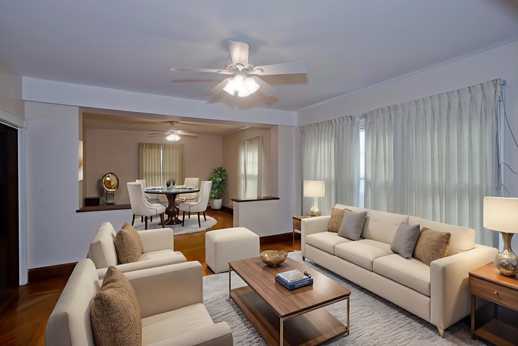 128 Maplewood Terrace Springfield, MA 01108 - Photo 14 of 40 a living room with furniture and a chandelier