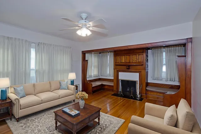 a living room with furniture and a fireplace