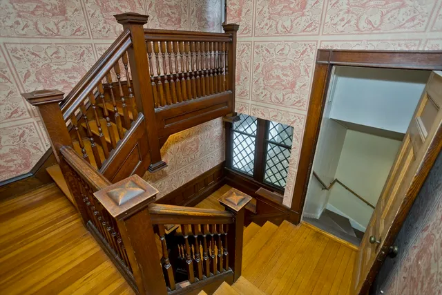 a view of stairs and with wooden floor