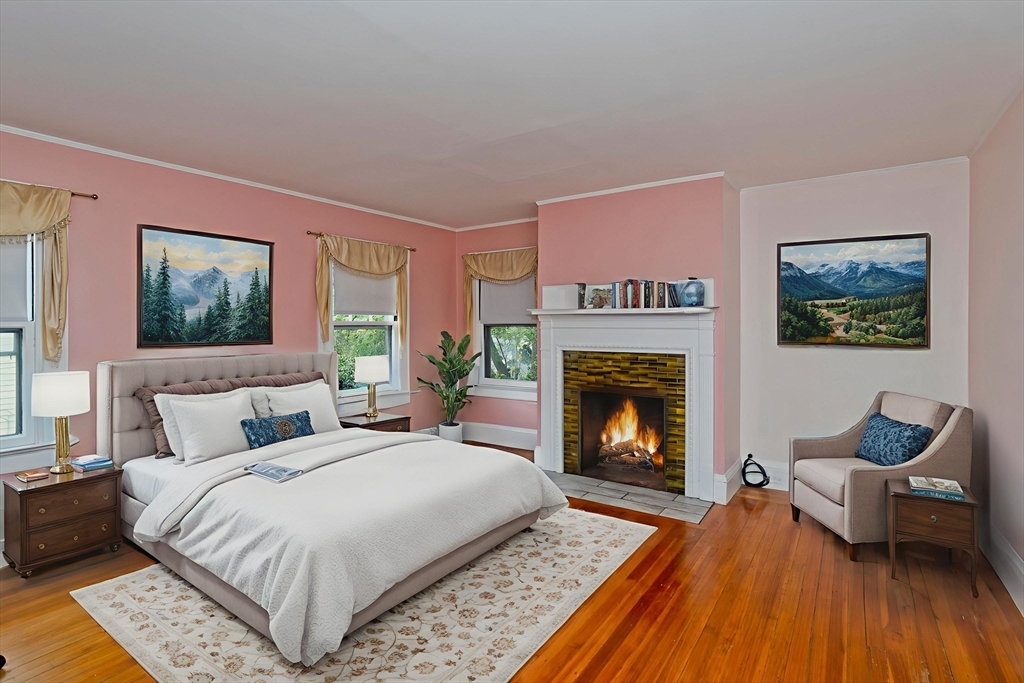 128 Maplewood Terrace Springfield, MA 01108 - Photo 27 of 40 a bedroom with a bed and a fireplace