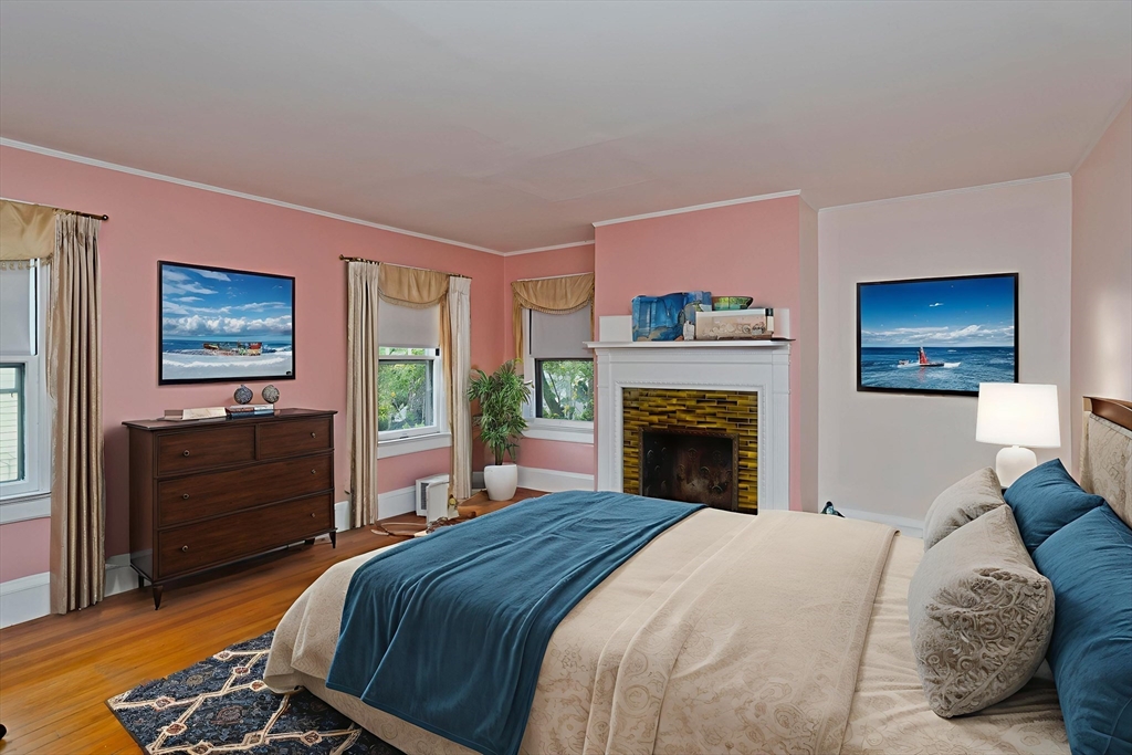 128 Maplewood Terrace Springfield, MA 01108 - Photo 28 of 40 a bedroom with a bed and a fireplace